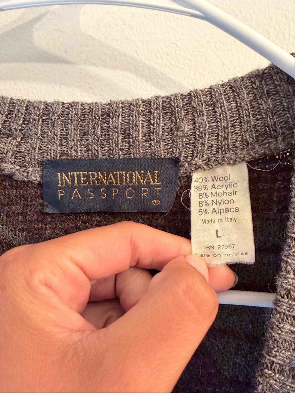 International passport button front